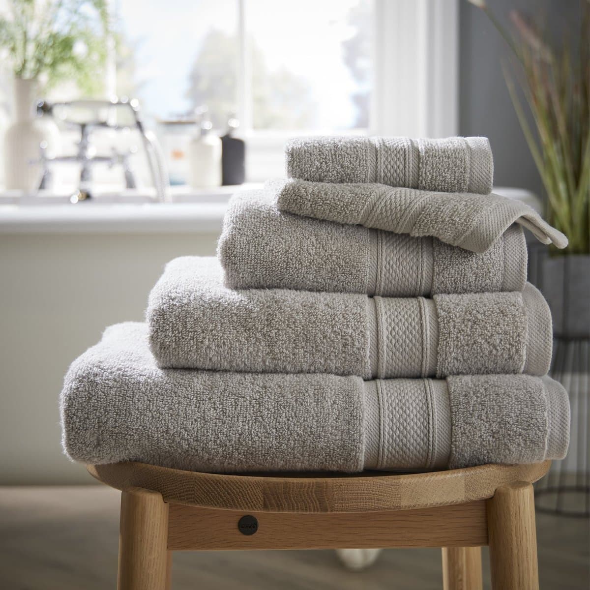 Grey cotton towels with a corded border