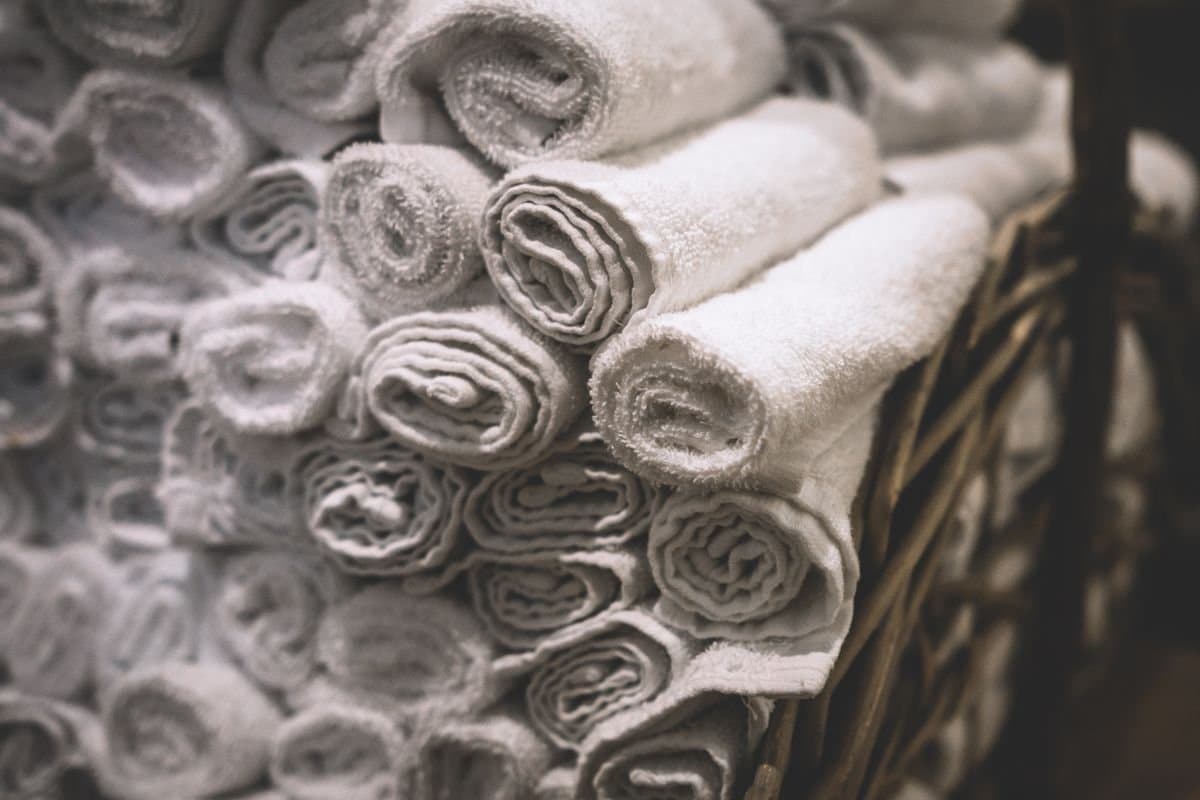 Neutral towels draped on a ladder