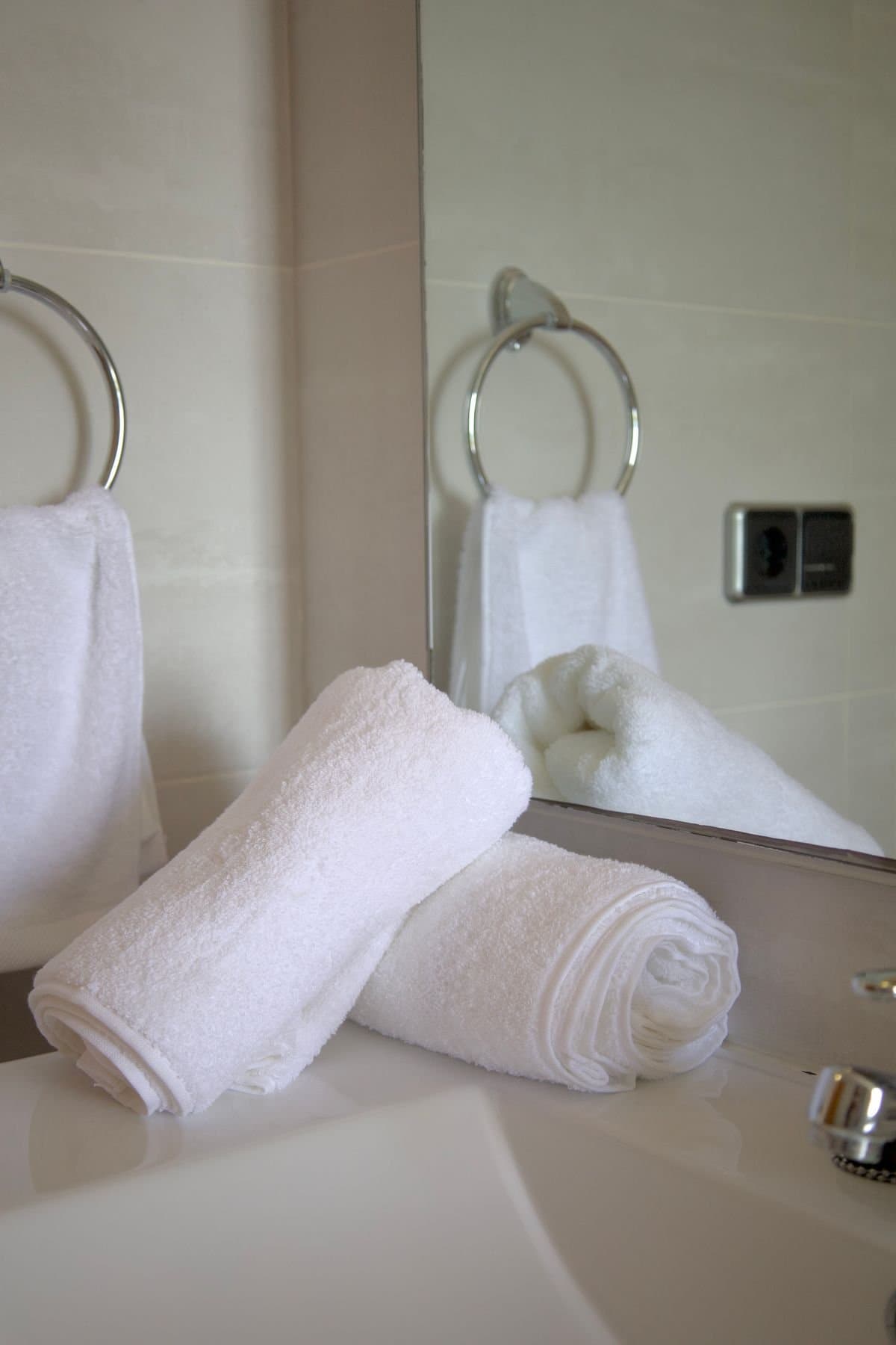 A white hand towel on a ring