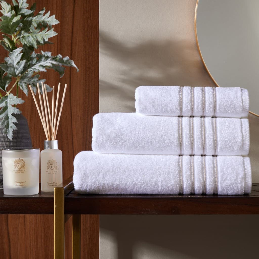 White bath towels with grey four-row cord border