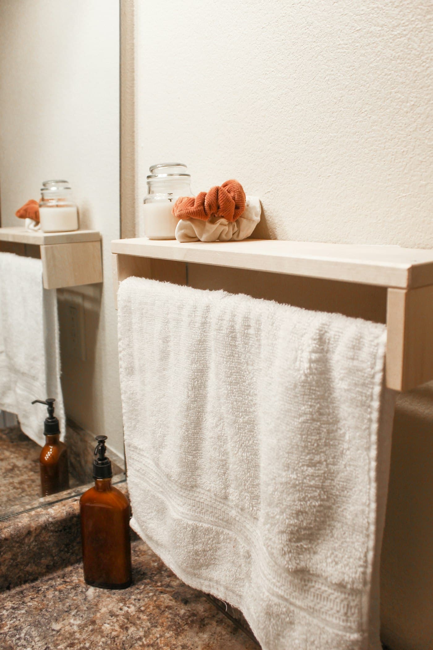 White spa bath towel over a wooden rail
