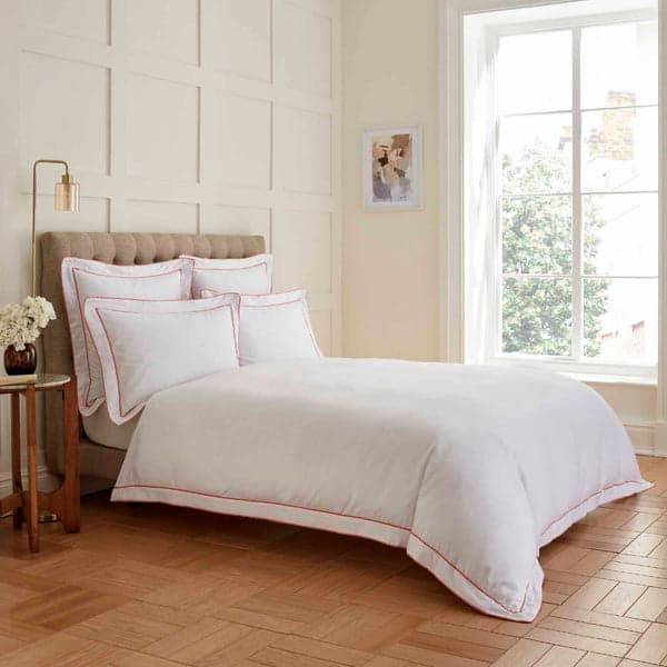 White duvet set with coral pink double tape edge