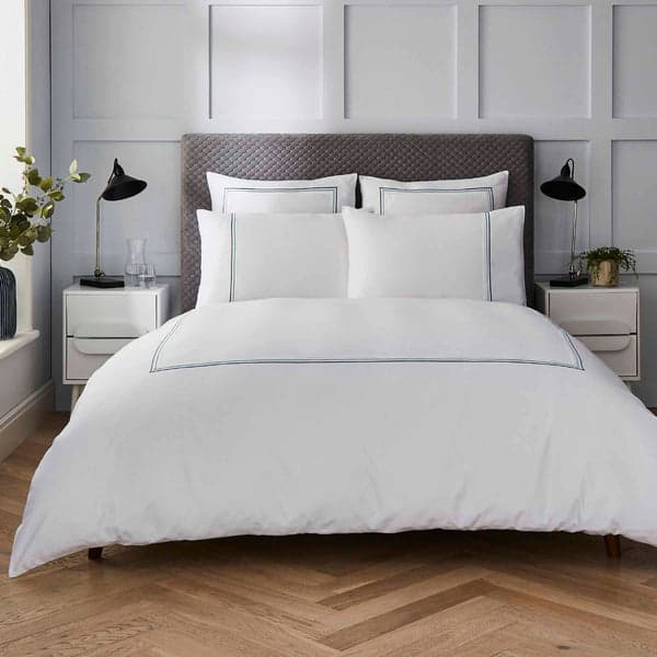 White duvet set with green triple row cord embroidery