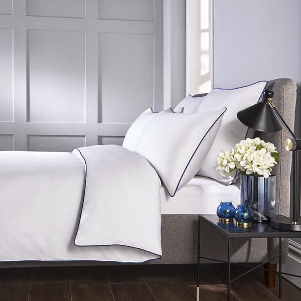White piped edge duvet set with navy trim