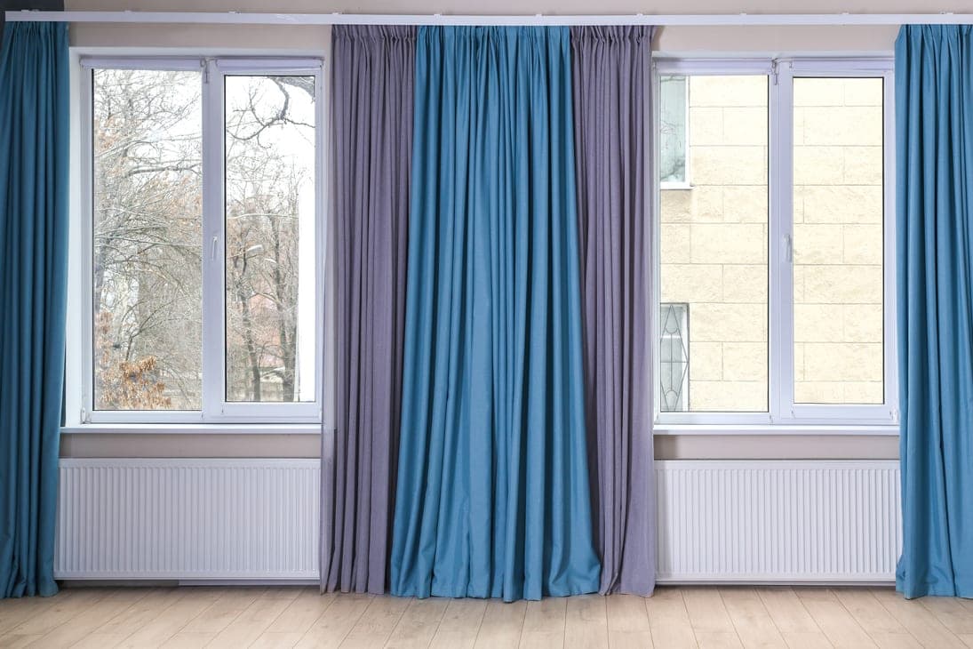 Deep blue curtains framing a window