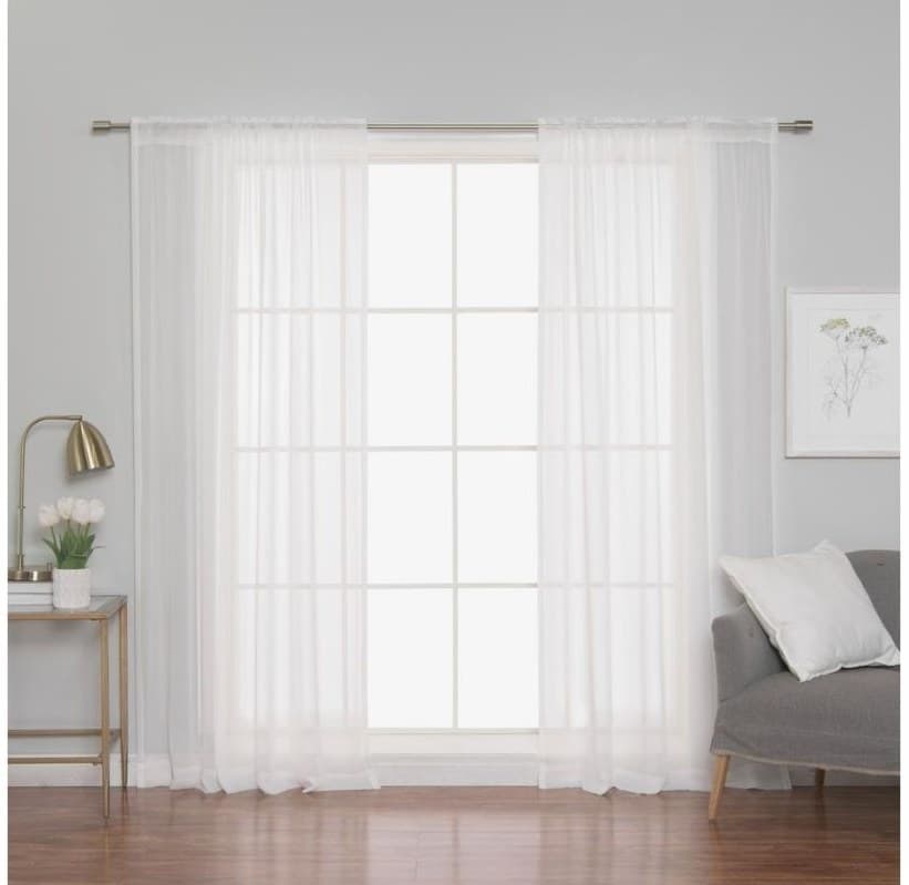 Off-white chiffon curtains on an eyelet heading