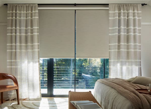 Oatmeal striped rod-pocket drapes in a bedroom