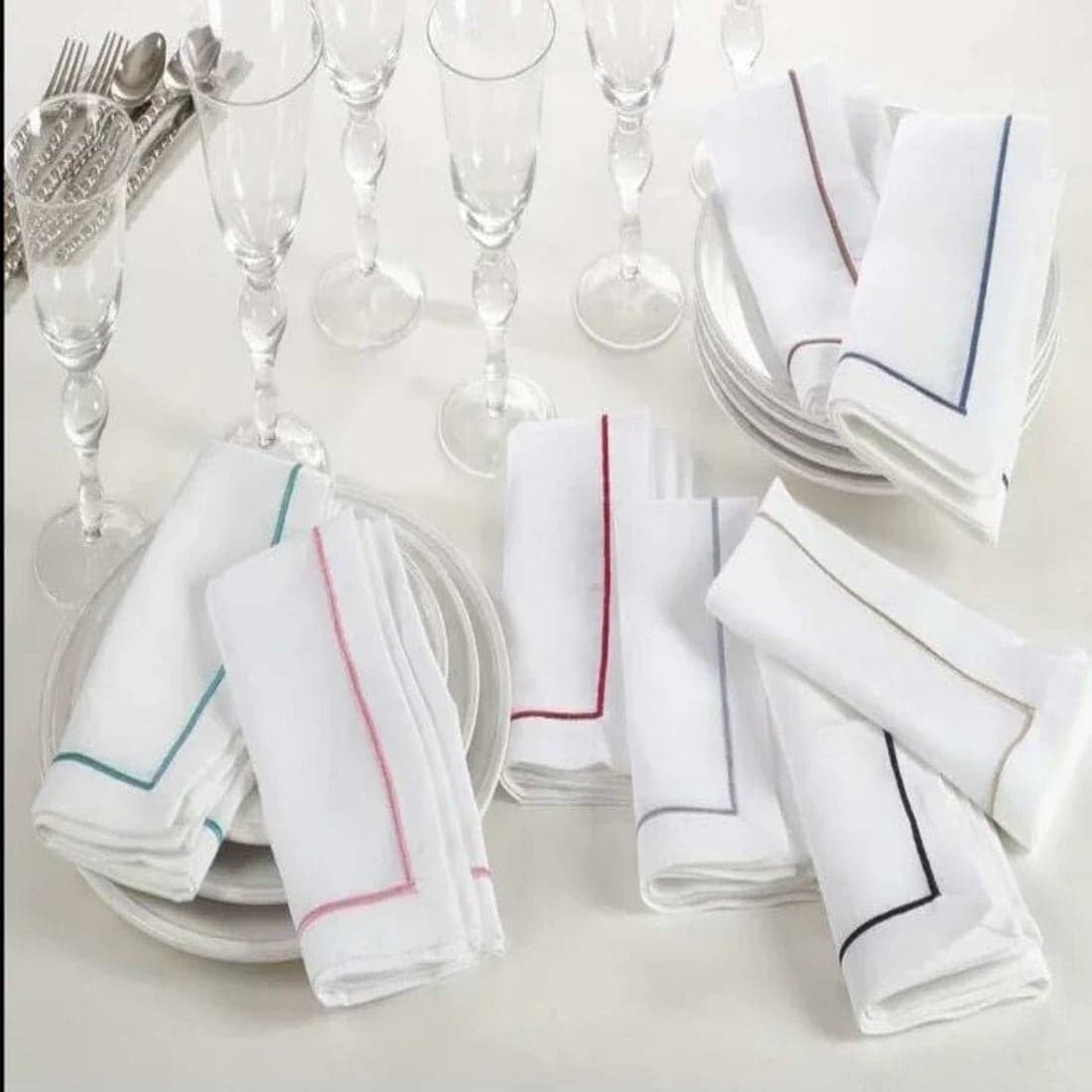Crisp white napkins laid on a white table