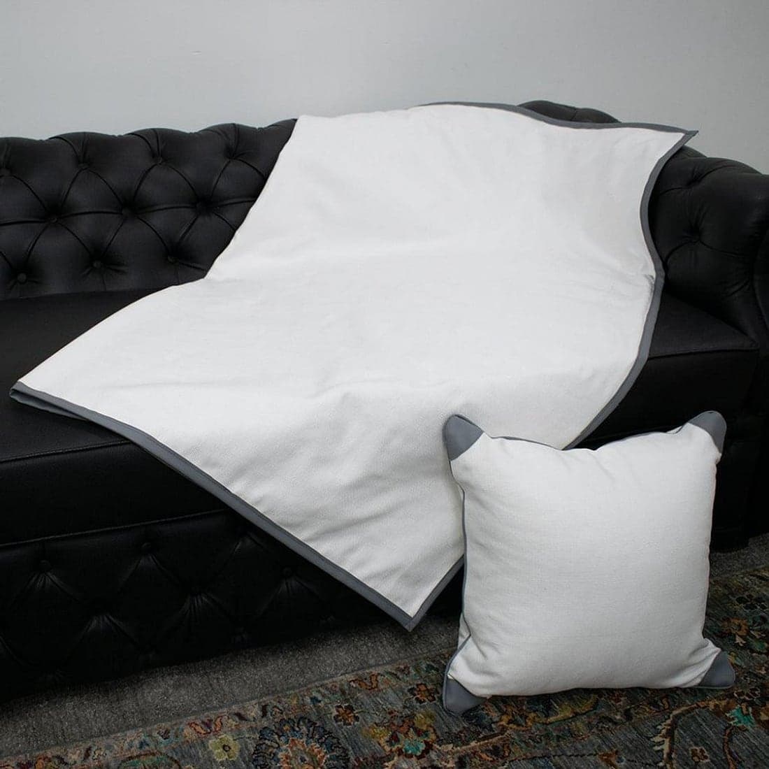 A soft white throw and cushion