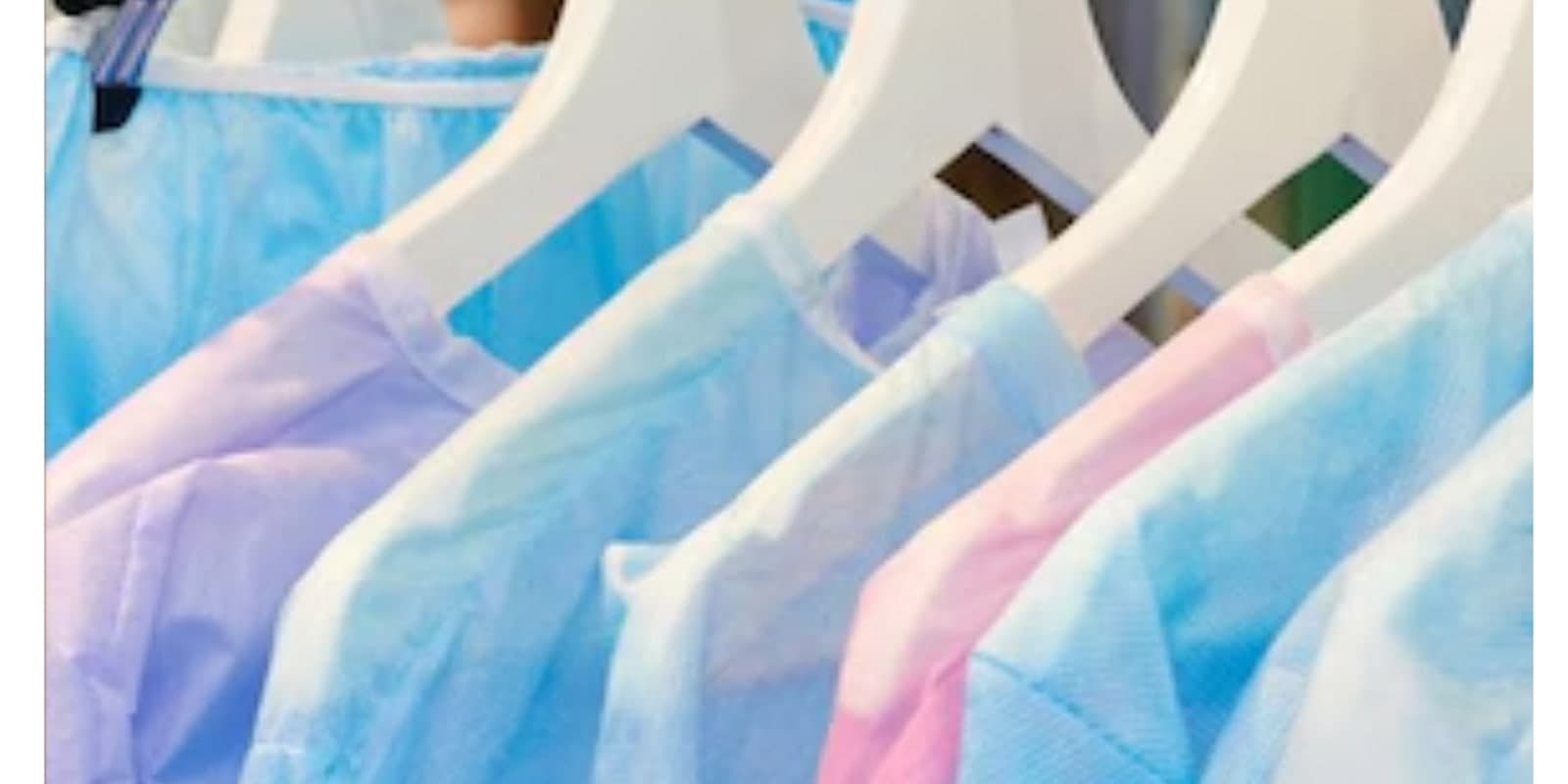 A rack of sterile surgical gowns