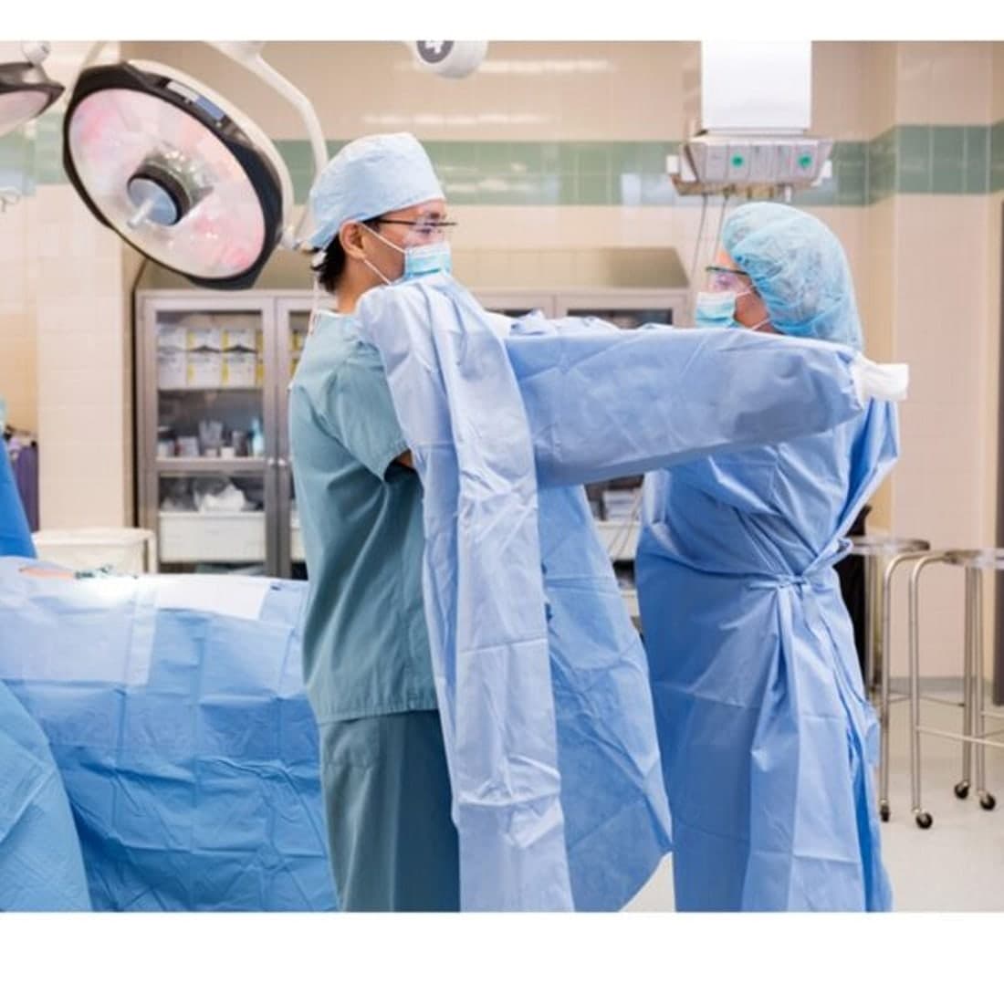 Surgical staff gowning in the operating theatre