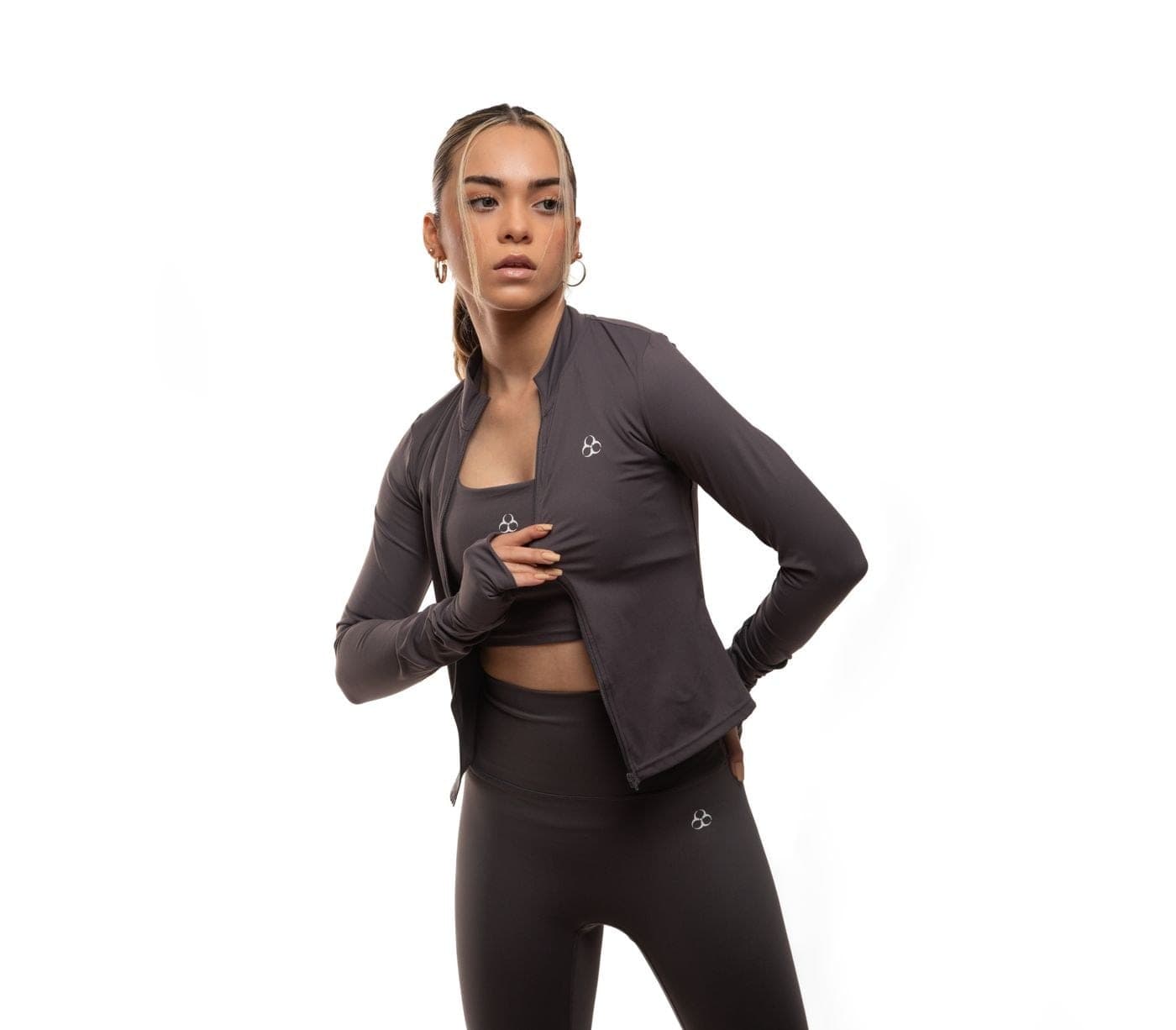 A woman in a taupe activewear set