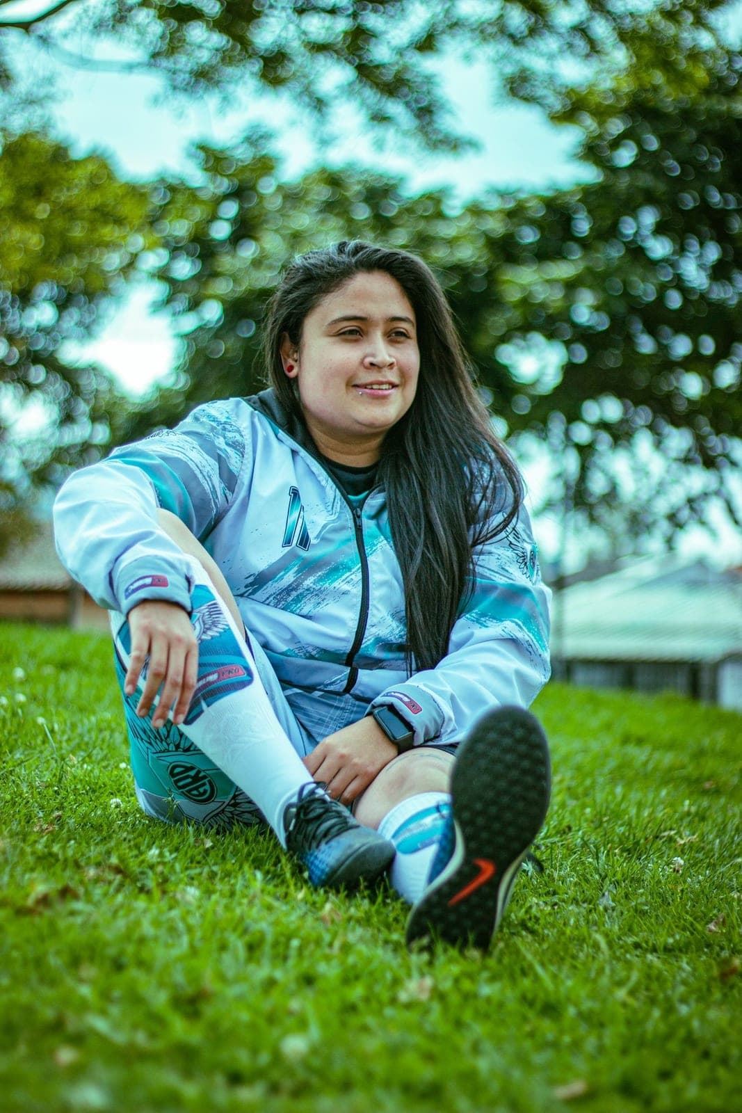 A woman in a soft teal tracksuit