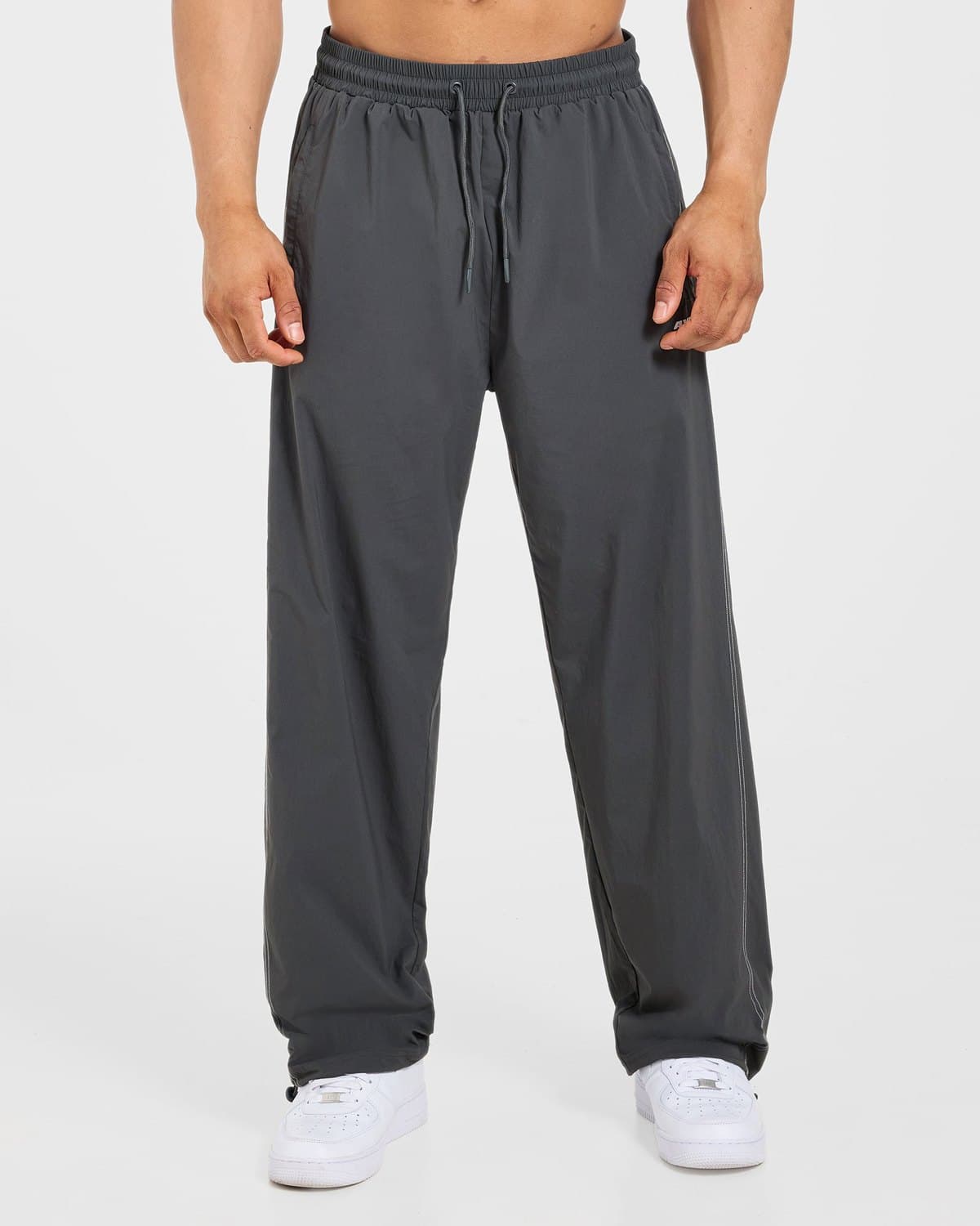 Male model in charcoal Restore track joggers