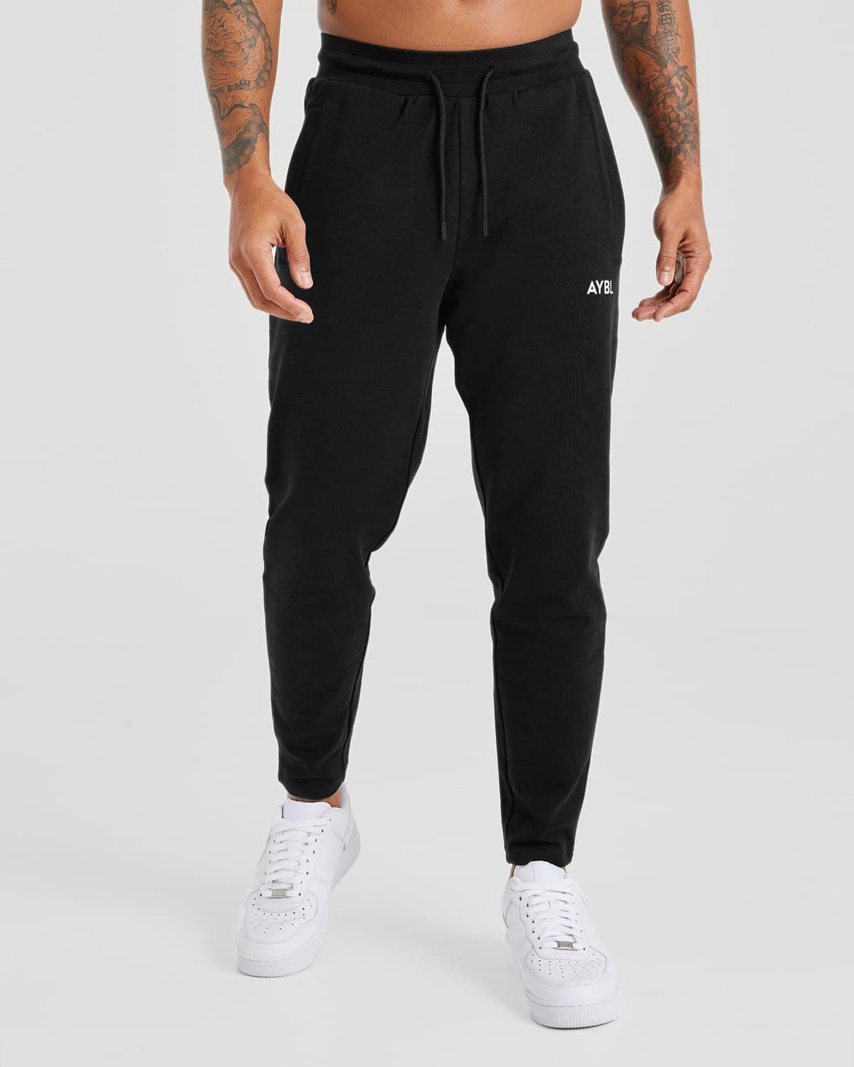 Male model in black Origin slim joggers