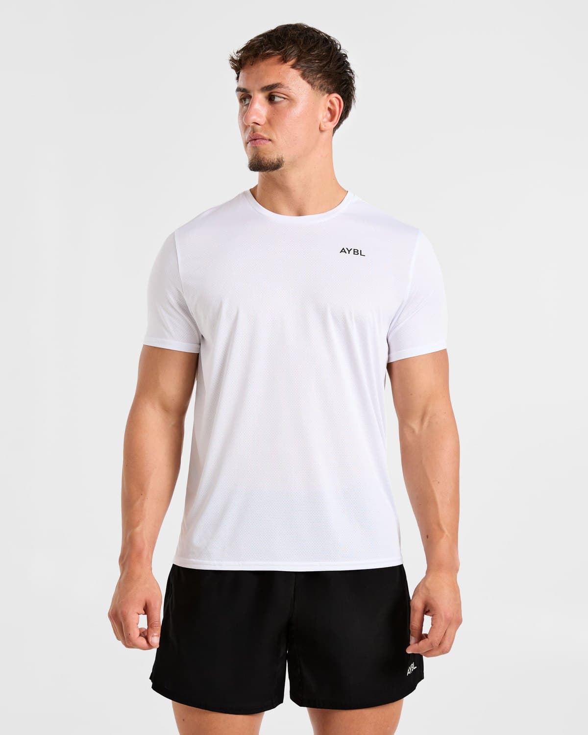 Male model in a white Essential training t-shirt