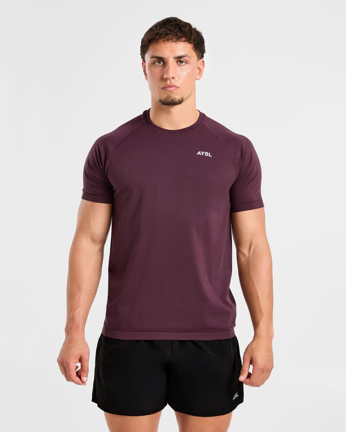 Male model in a deep plum seamless training t-shirt