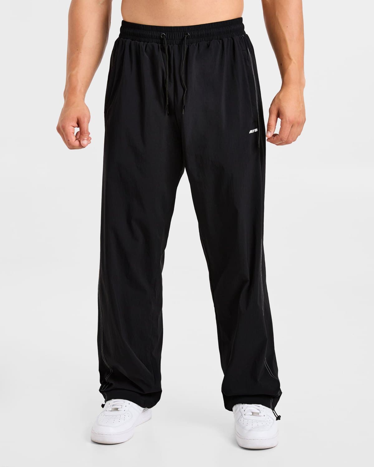 Male model in black Restore track pants