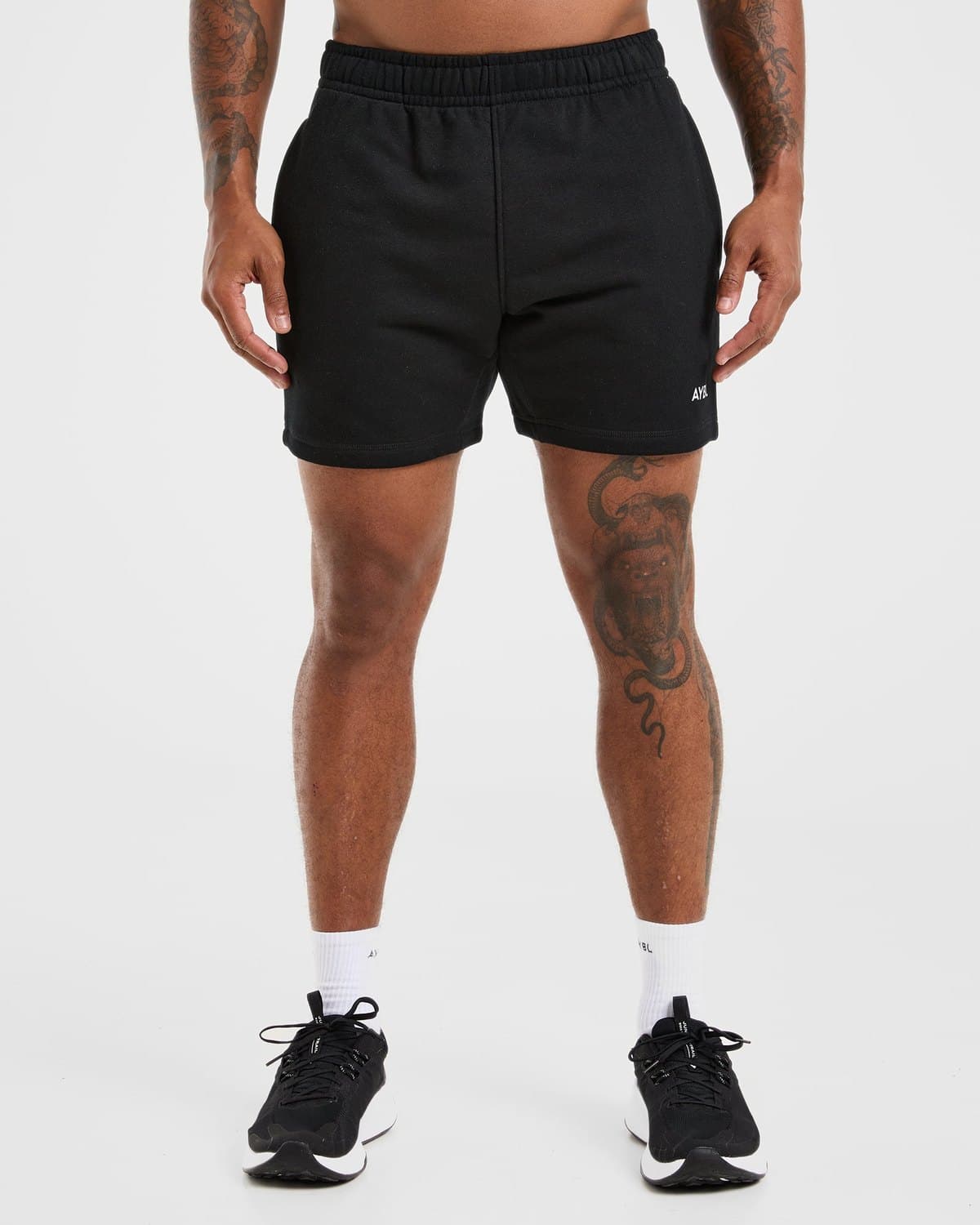 Male model in black Essential sweat shorts