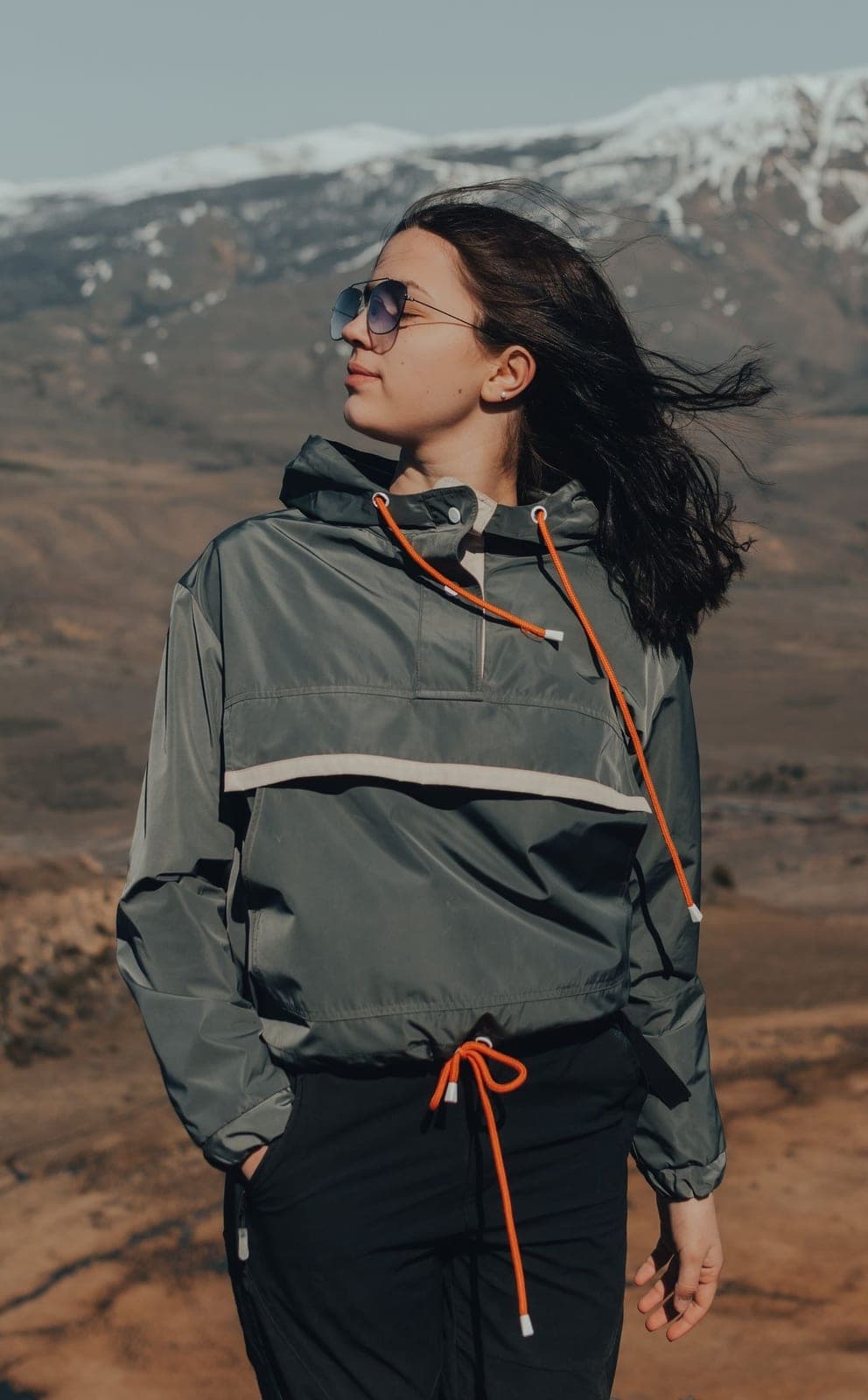 A model in a soft khaki windbreaker