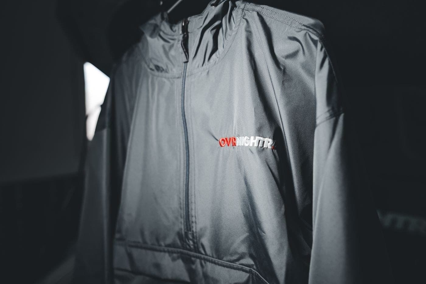 A grey jacket on a hanger