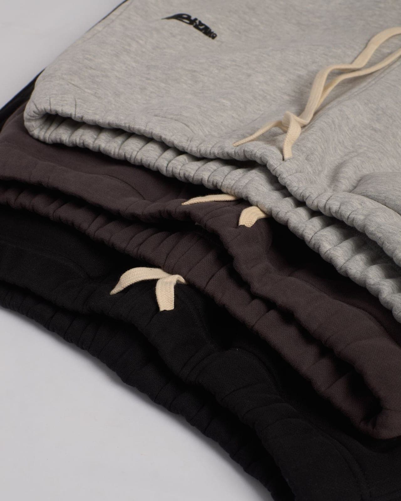 A folded stack of joggers