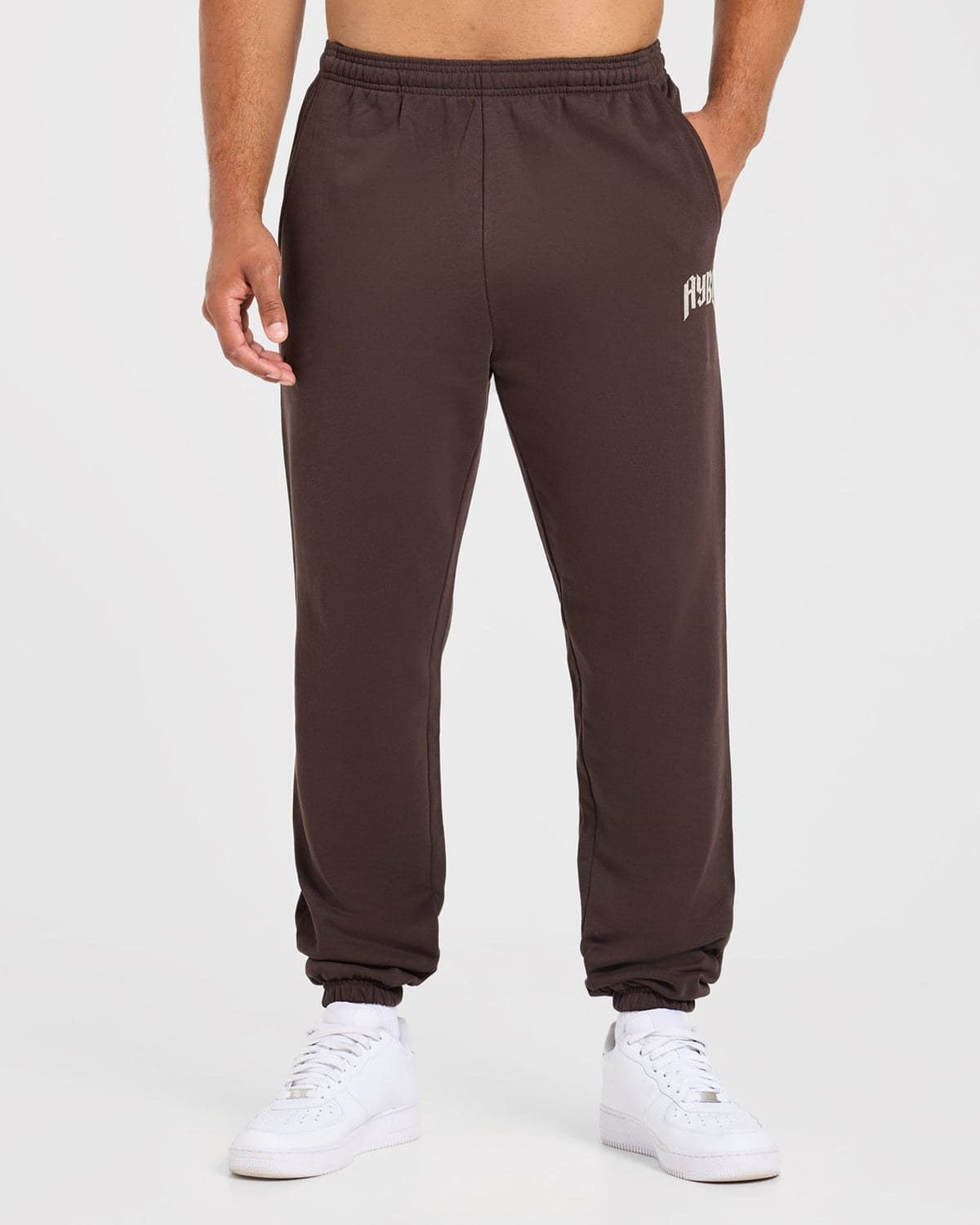Brown oversized training joggers on model
