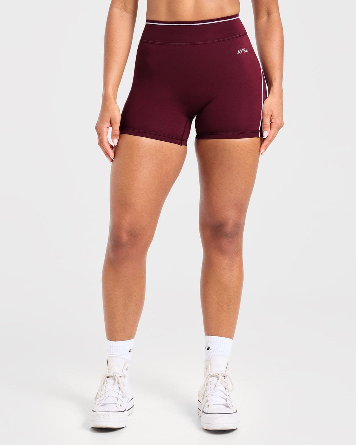 Deep mulberry training shorts on model
