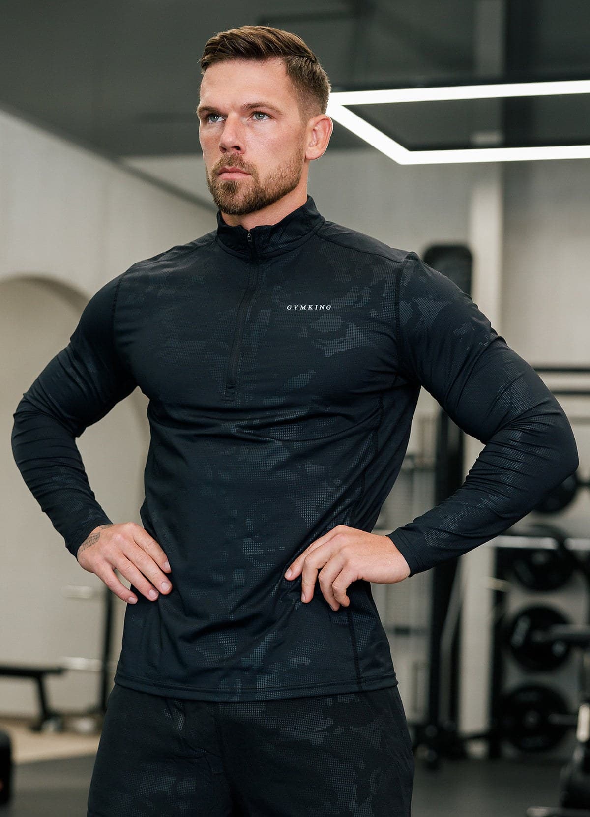 Black camo quarter-zip funnel on model