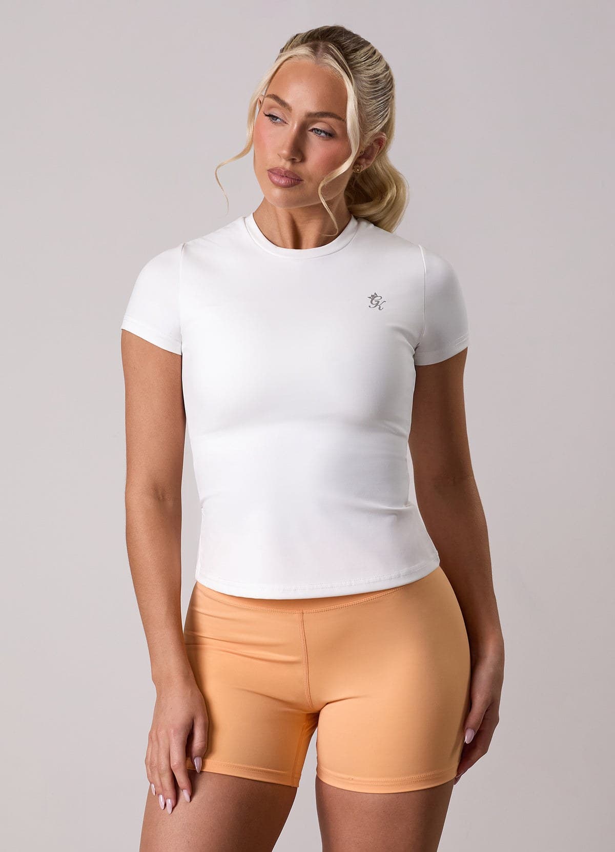 White built-in-bra training tee on model