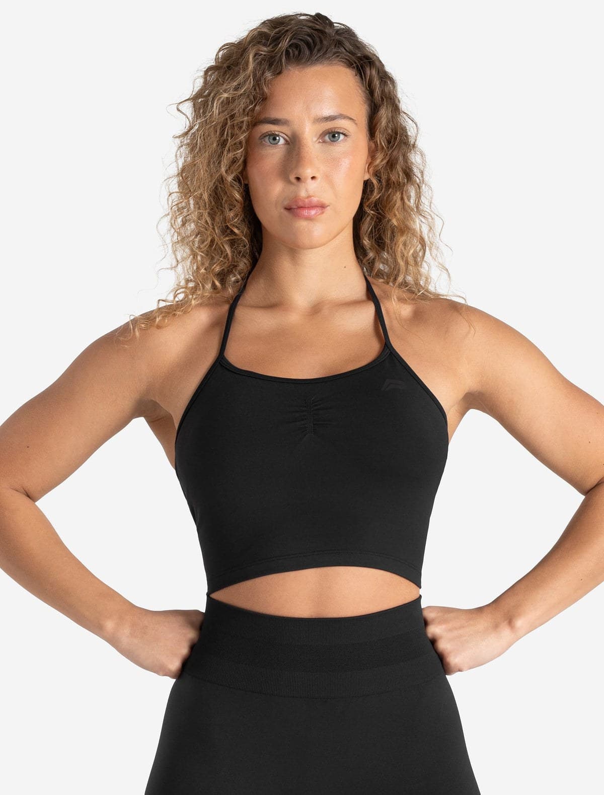 Black seamless training bra tank on model