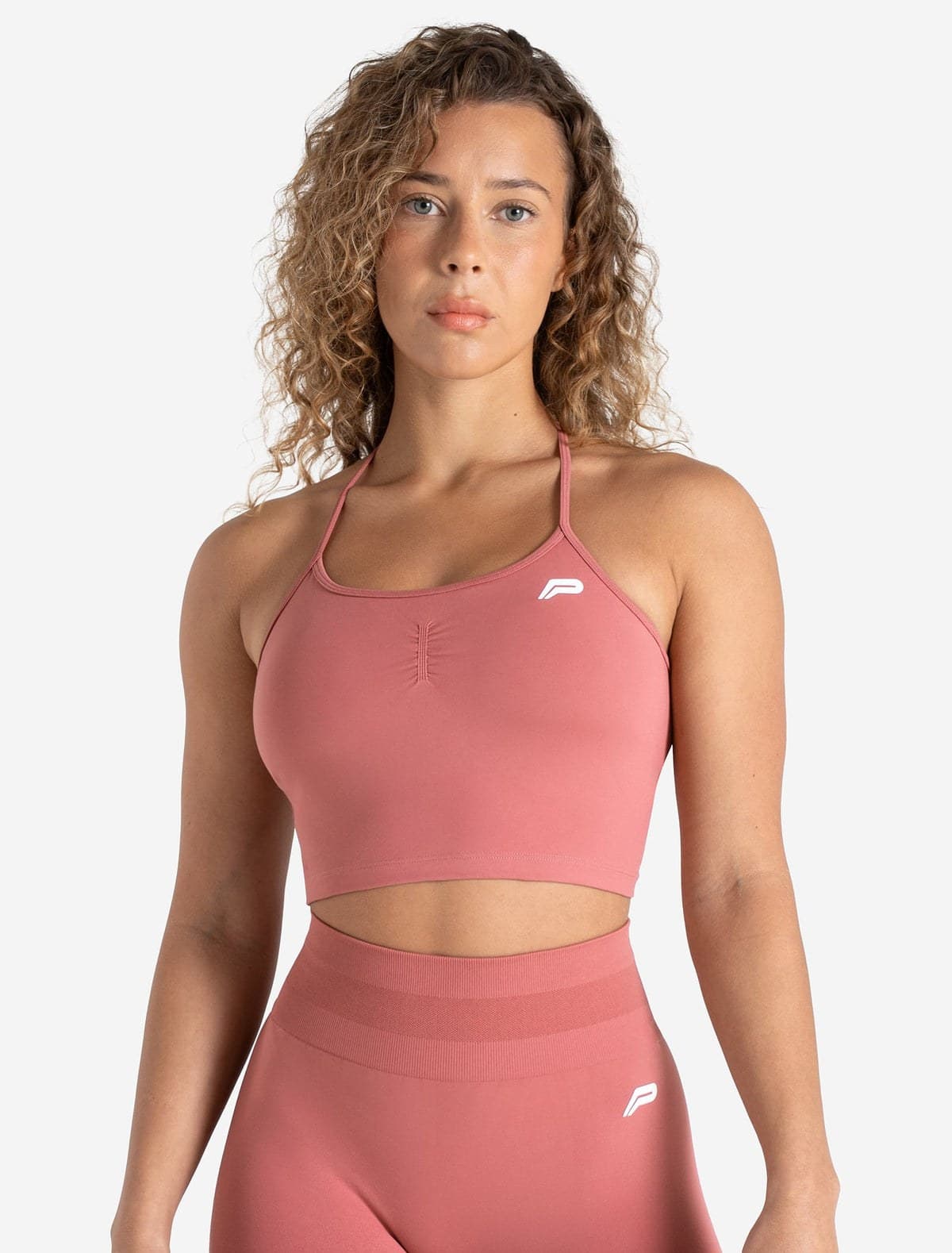 Peony pink seamless training bra tank on model