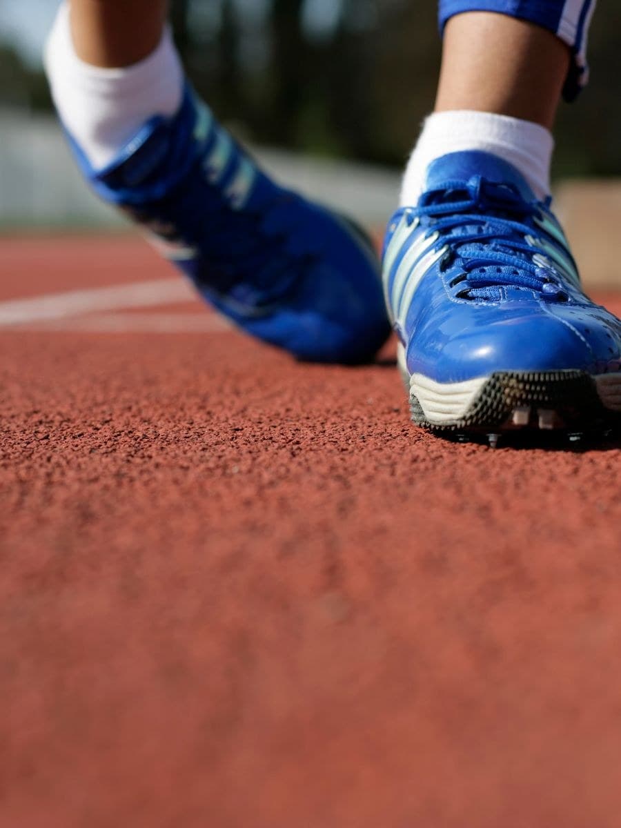 Running spikes on an athletics track