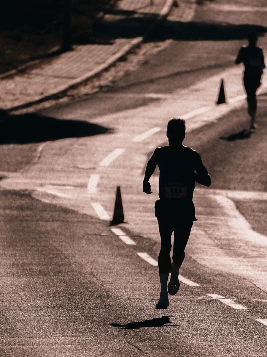 A runner mid-stride on the road