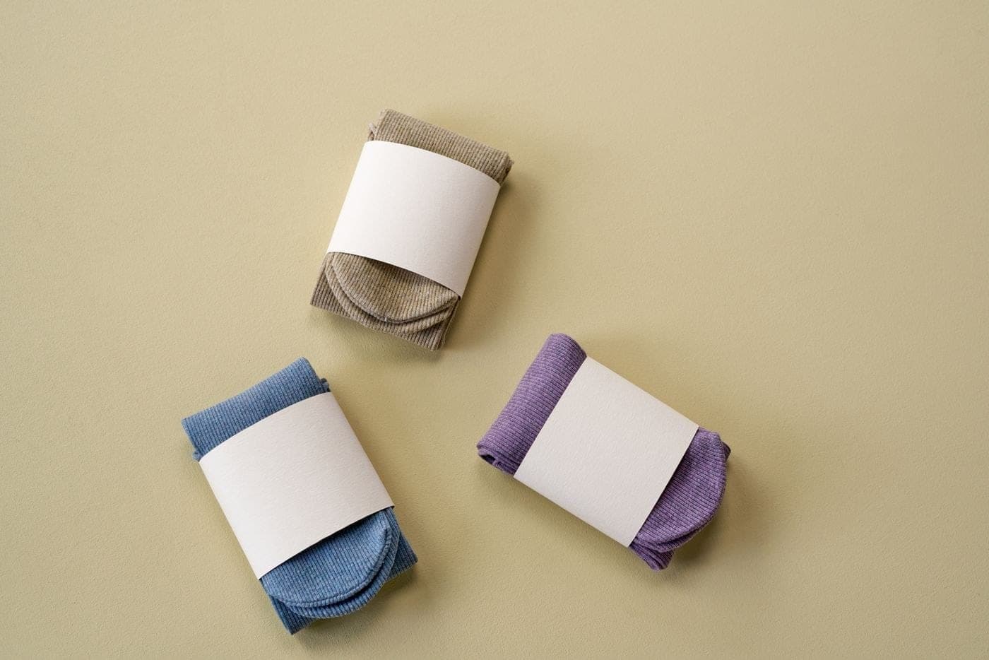 Rolled sports socks on a neutral background