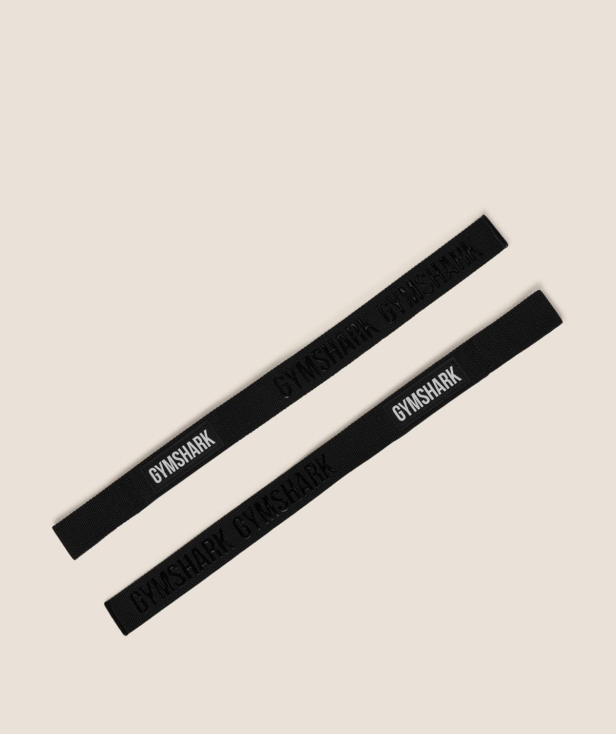 A pair of black silicone lifting straps