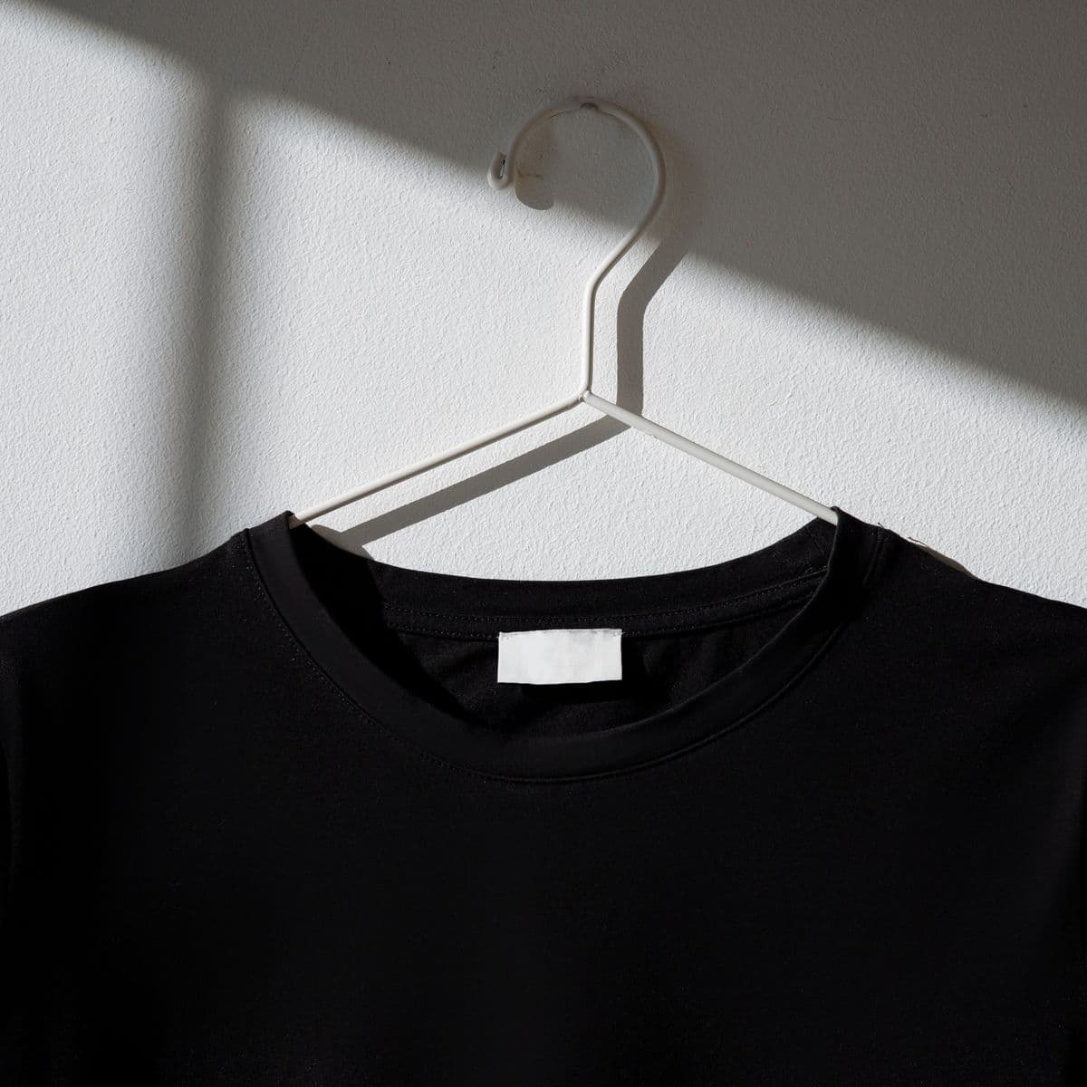 A black jersey neckline on a hanger