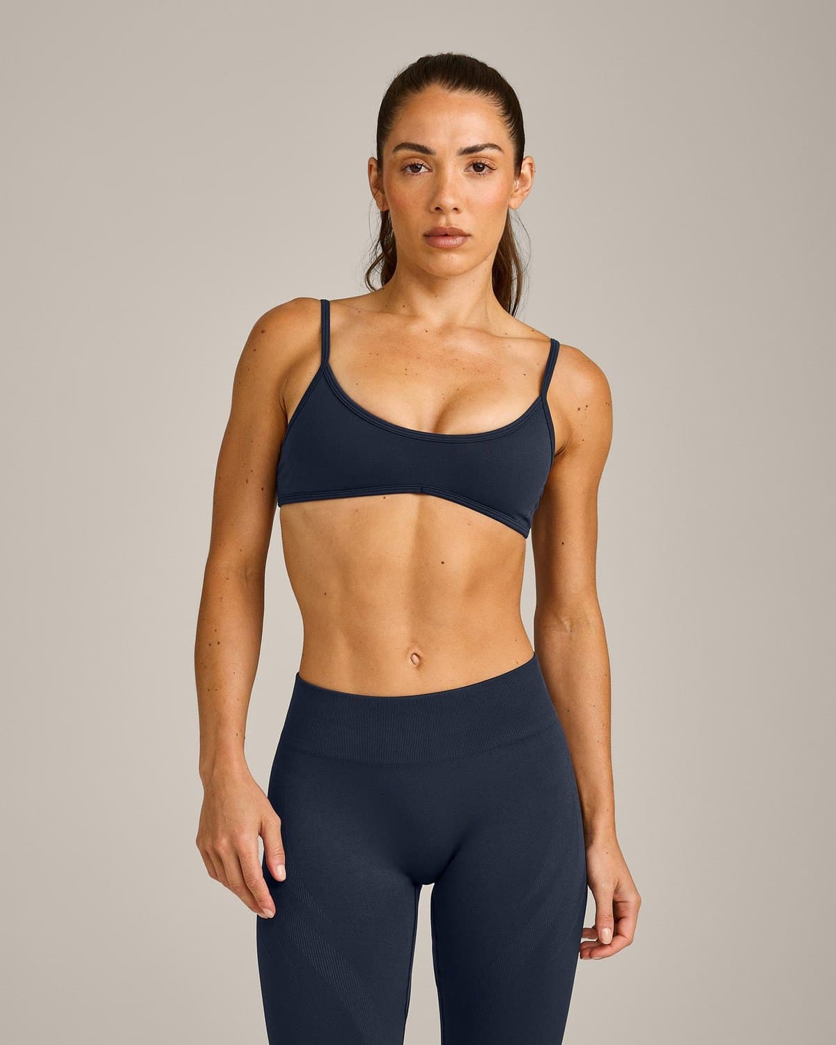 Female model in a navy seamless set