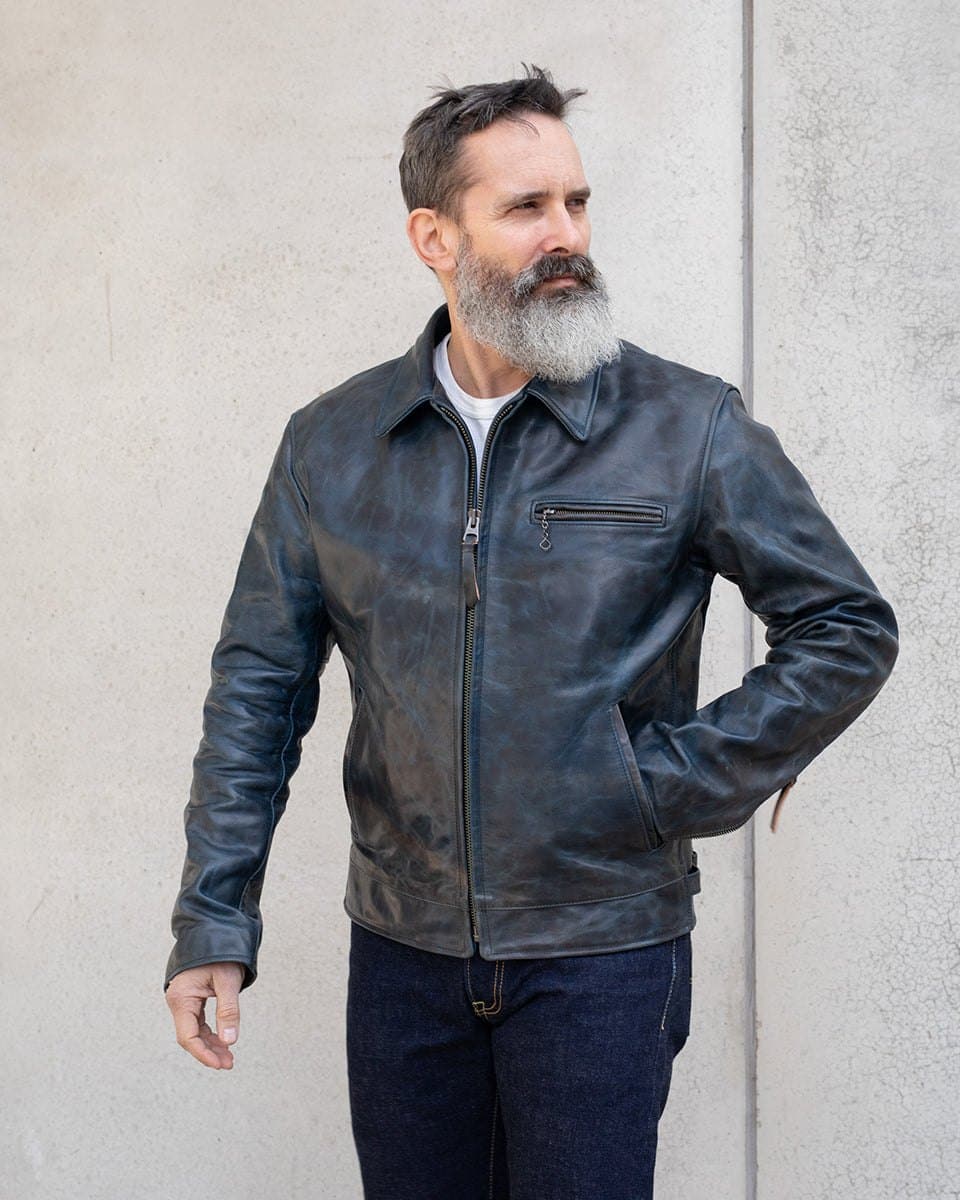 Model in an indigo distressed horsehide jacket