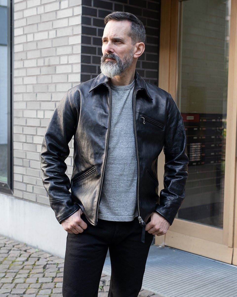 Model in a black vintage horsehide riders jacket