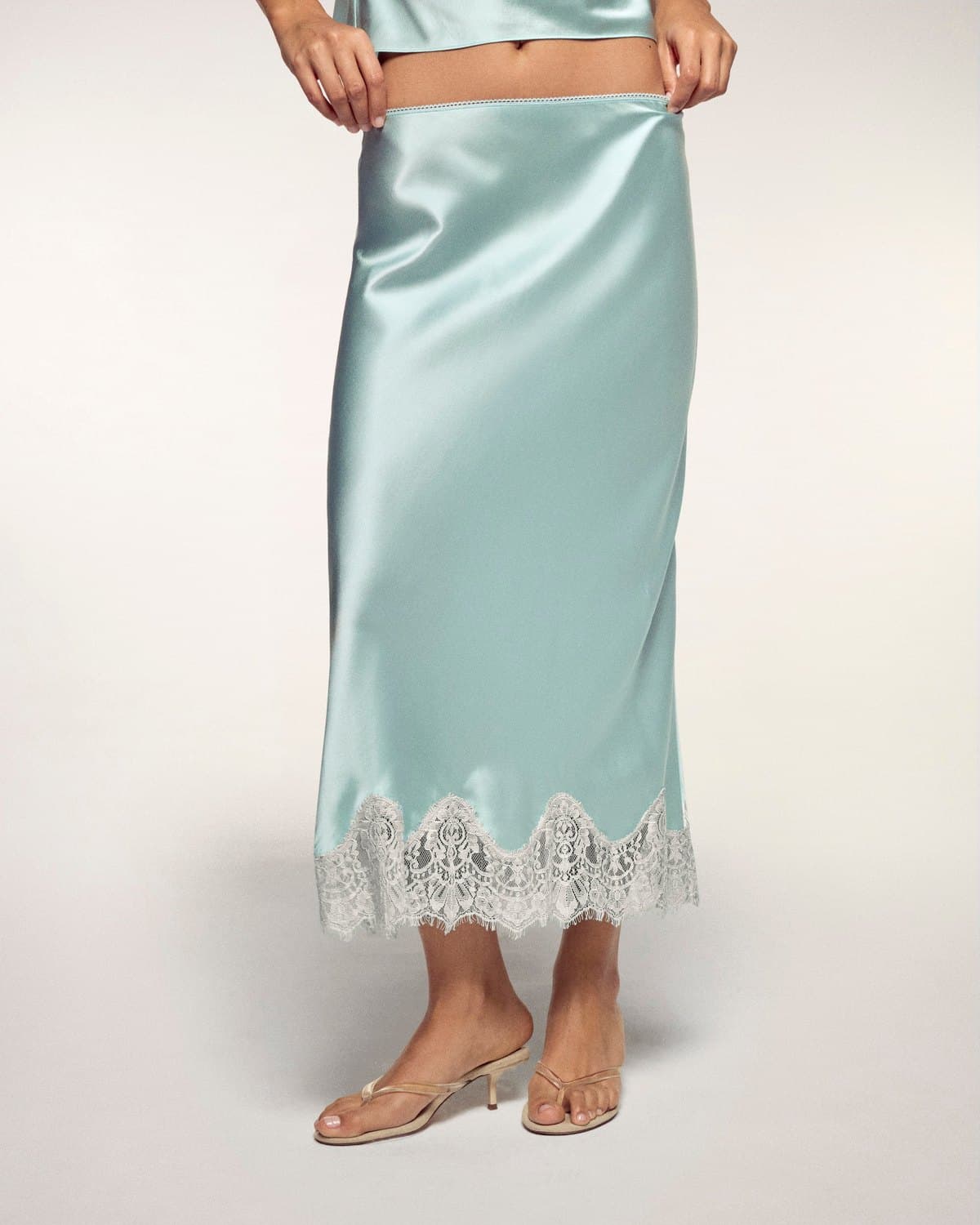 Aqua satin midi skirt with a lace hem