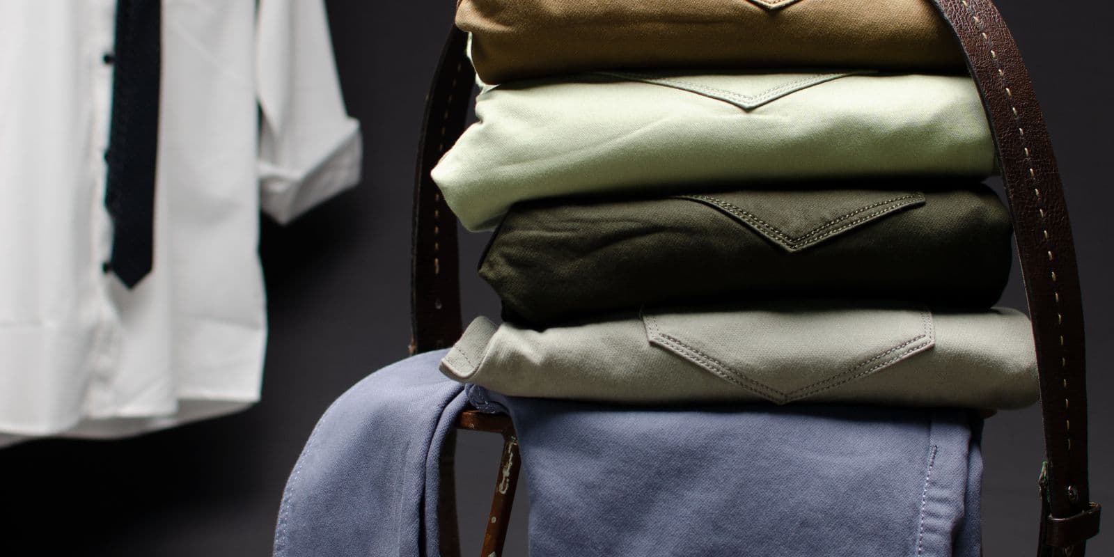 A tall stack of folded work shirts