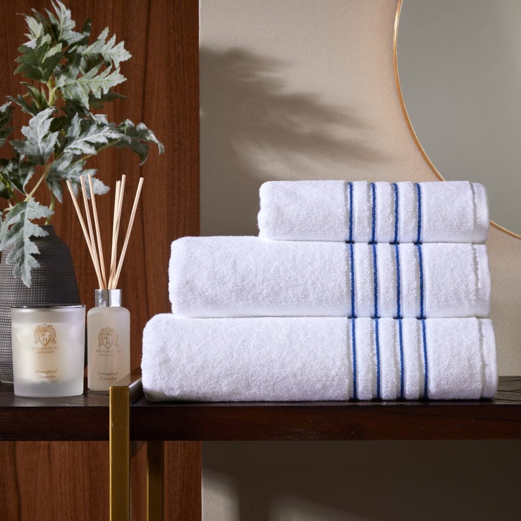 White bath towels with navy four-row cord border