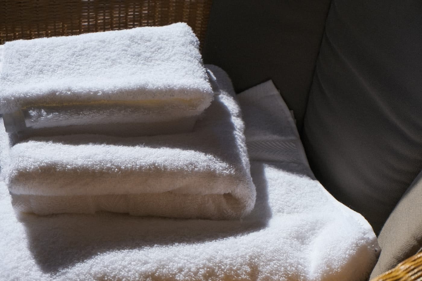 A stack of folded soft white bath towels