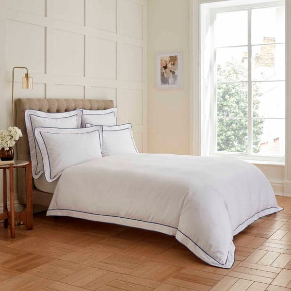 White duvet set with navy double tape edge