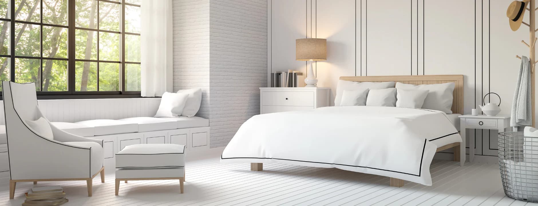 A bright, airy bedroom dressed in soft white bed linen