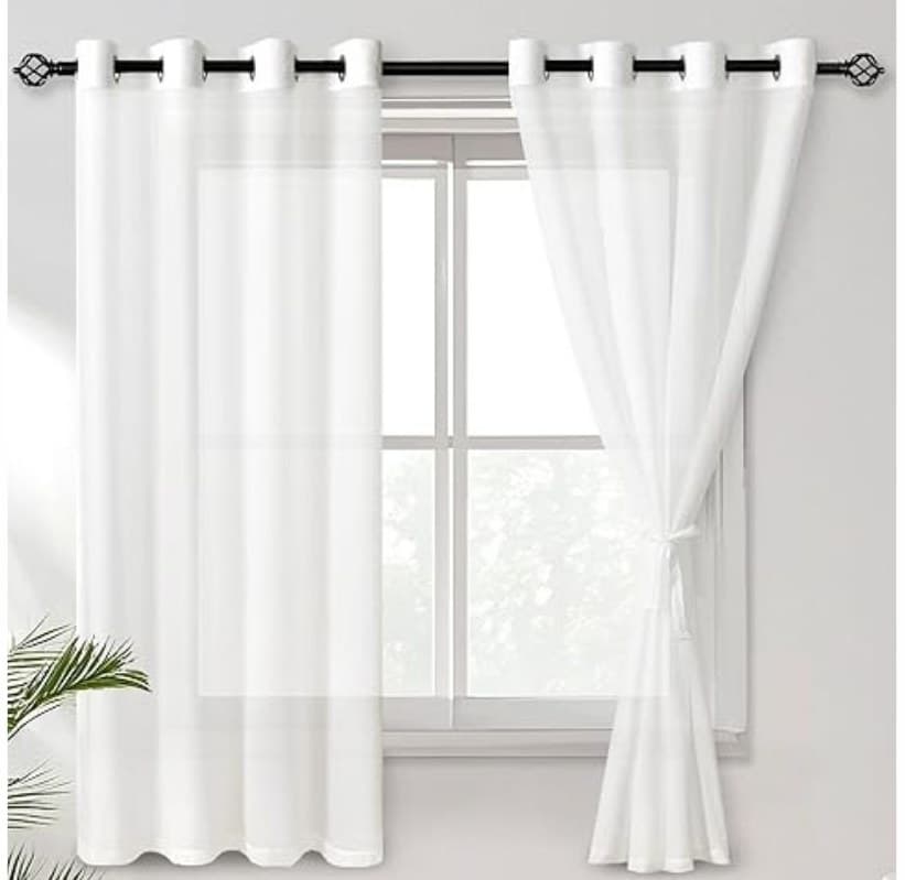Off-white chiffon curtains on a ring top with tieback