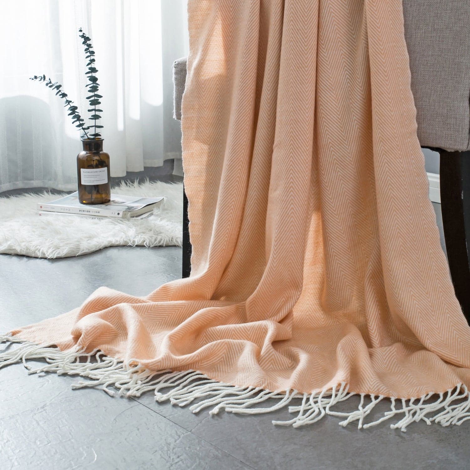 Peach woven herringbone patterned throw