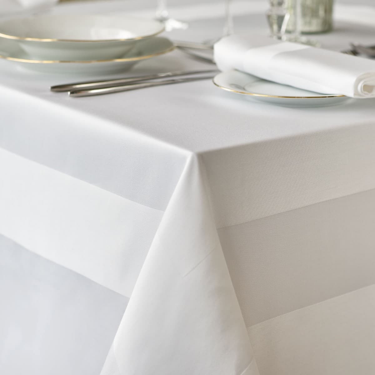 White cotton tablecloth with a satin band edge