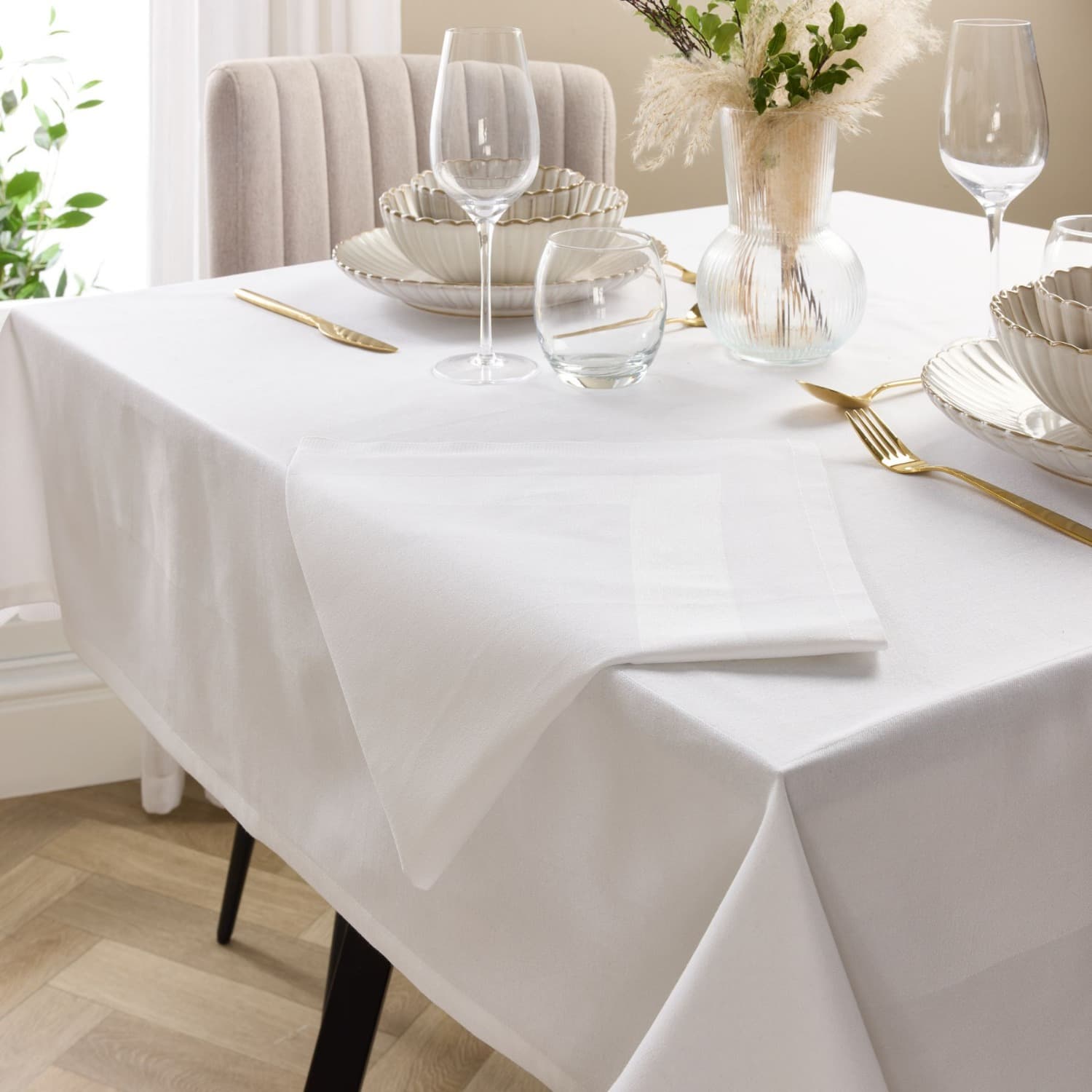 White cotton tablecloth with a satin band